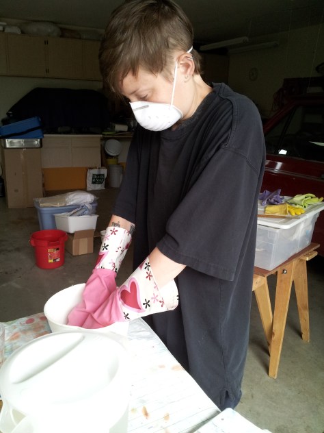 A dust mask and rubber gloves are necessary safety precautions.