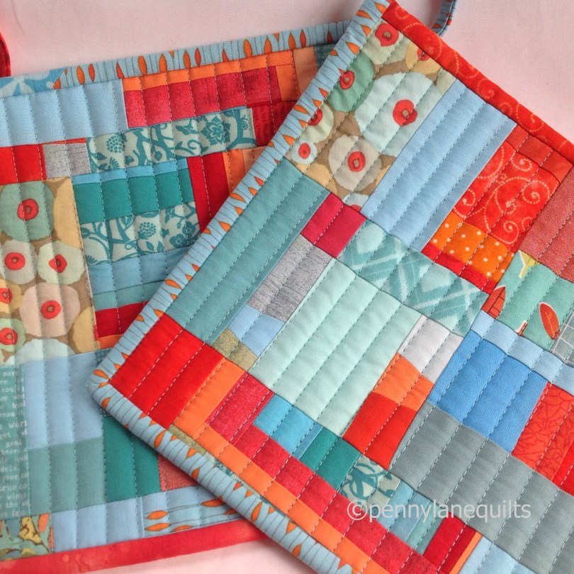 potholders, aqua and orange