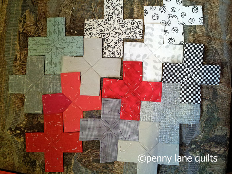 plus units for epp plus quilt laid out on the sofa of our horse trailer