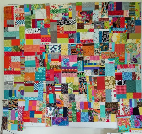scrap vortex quilt on design wall